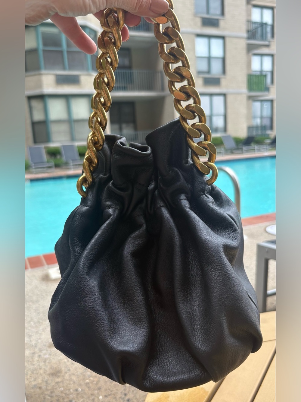 STAUD Black Leather Drawstring Duffel with Gold Chain Handle
